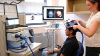 Physician conducting a scan on a patient